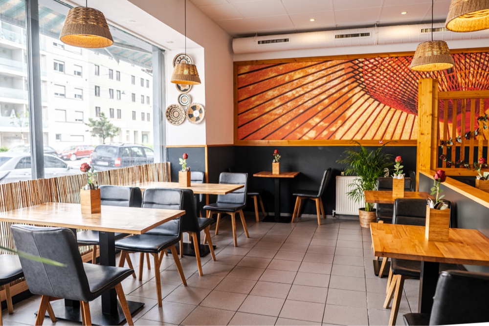 Dining room beneath the sunburst mural